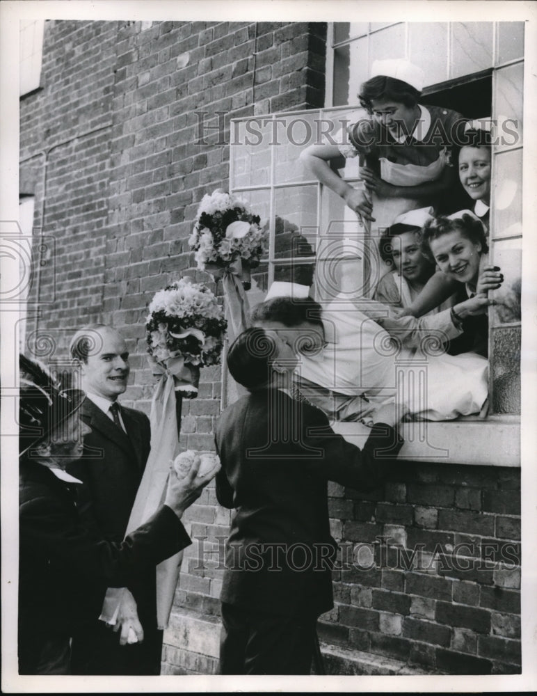 Load image into Gallery viewer, 1955 Press Photo Hungerford England Hook Tuesday duty of collecting kisses
