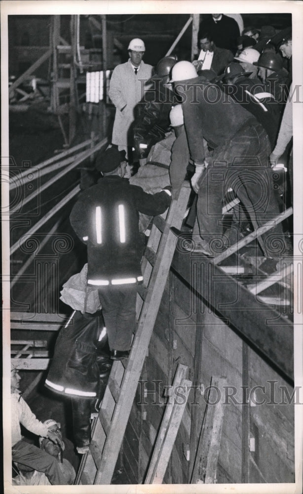 Load image into Gallery viewer, 1964 Press Photo Firemen rescue M Conway from construction accident
