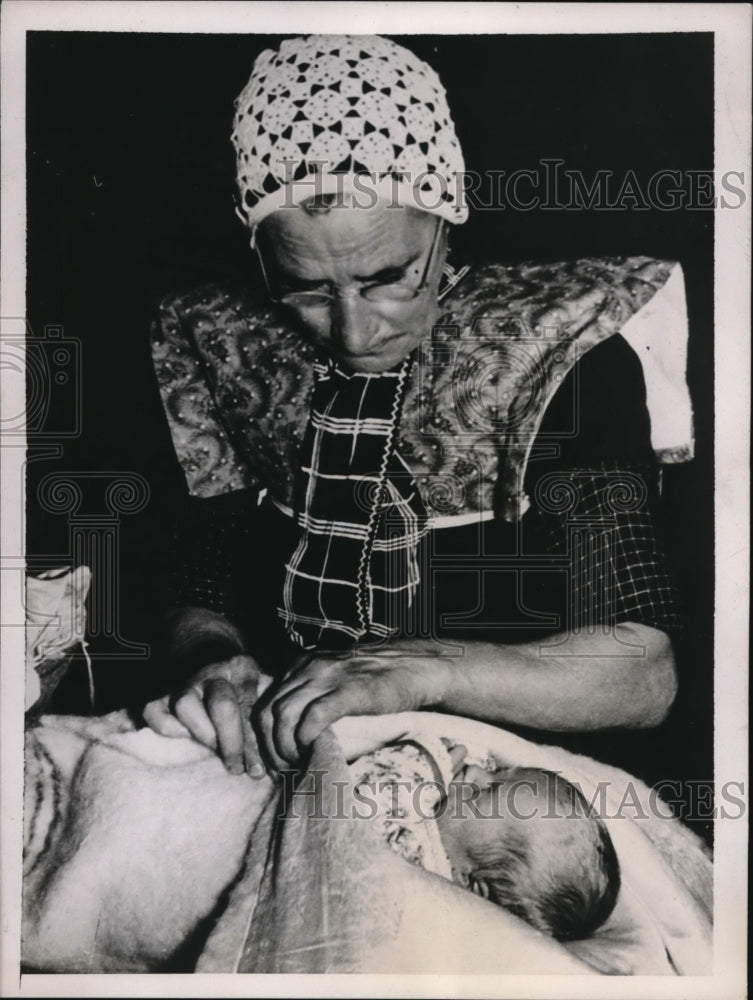 1937 Press Photo Baby being packed in Little Dutch fishing village tradition