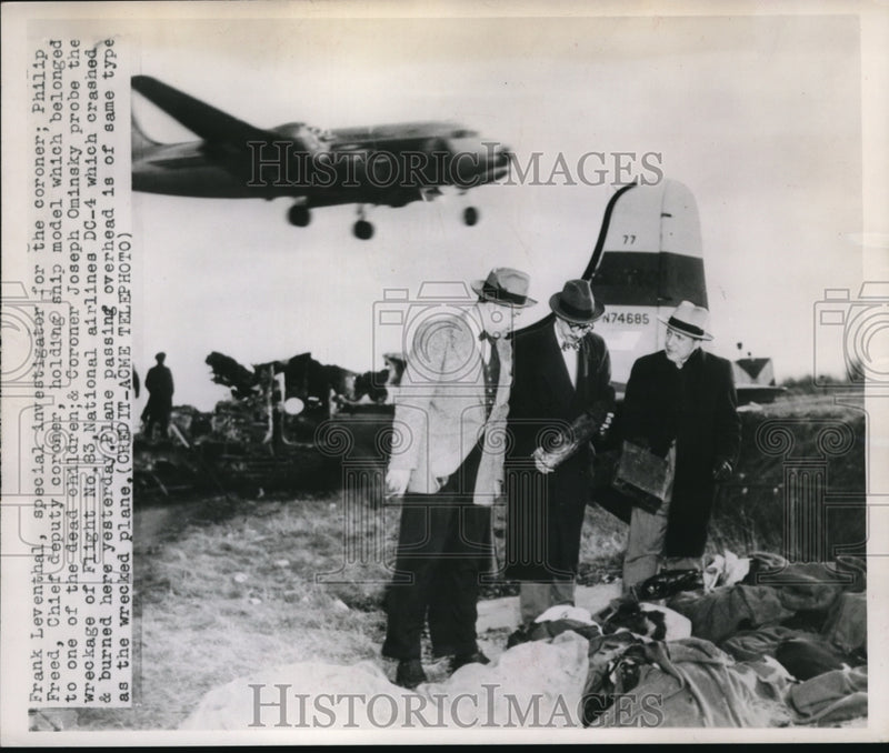 Load image into Gallery viewer, 1951 Press Photo Investigator Philip Freed checks the wreckage of a plane
