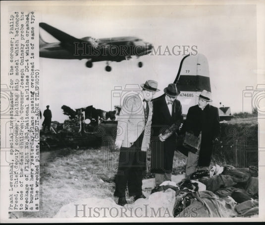 1951 Press Photo Investigator Philip Freed checks the wreckage of a plane