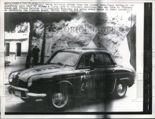 1957 Press Photo Monaco Motorists car with sign for Princess Grace