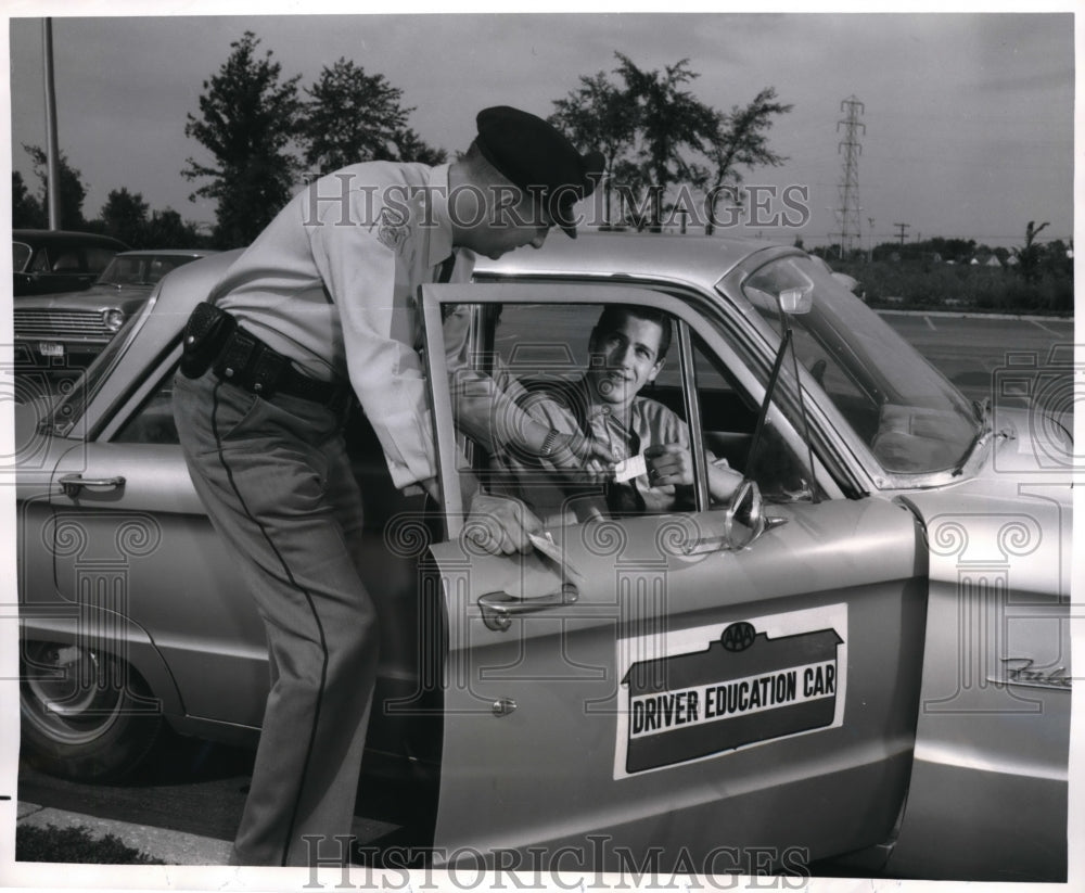 1963 Press Photo Albert Keskenny passes final exam and has Driver Education Cert