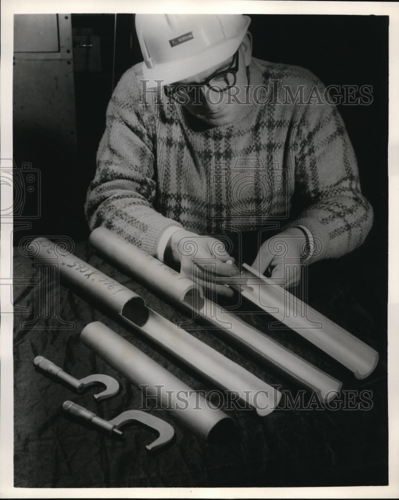 Load image into Gallery viewer, 1963 Press Photo Tom Gorman inspects steel pipe, Watervliet Works
