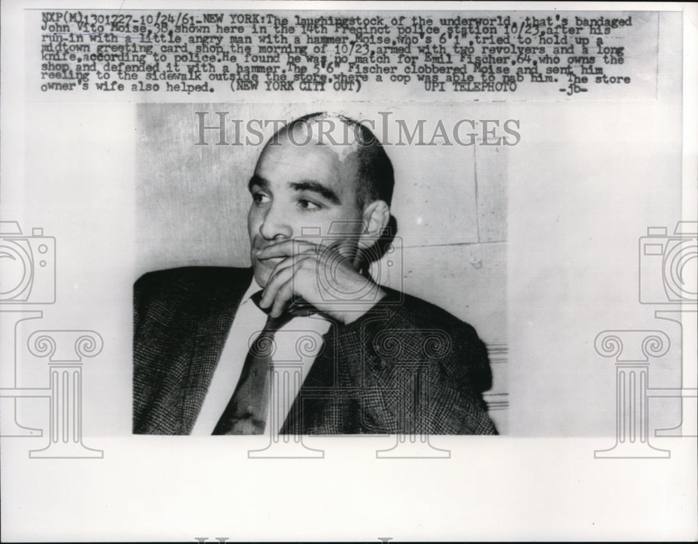 1961 Press Photo J. Moise is no match with the owner of the shop he tries to rob