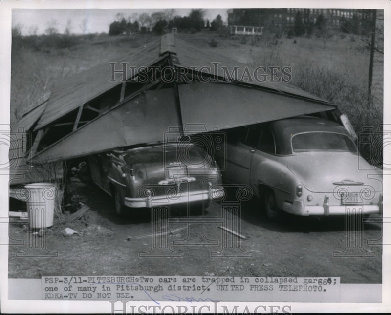 Load image into Gallery viewer, 1955 Press Photo Two cars trapped in a collapsed garage in Pittsburgh.

