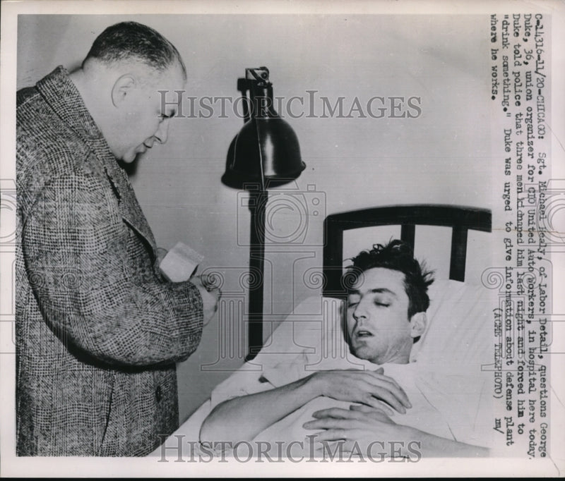 Load image into Gallery viewer, 1951 Press Photo Chicago Sgt M Haley &amp; union organizer Geo Duke injured
