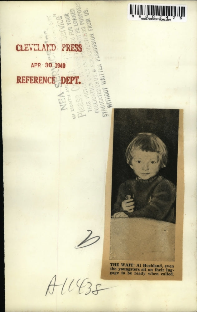 1949 Press Photo A baby sits on her luggage at Hochland