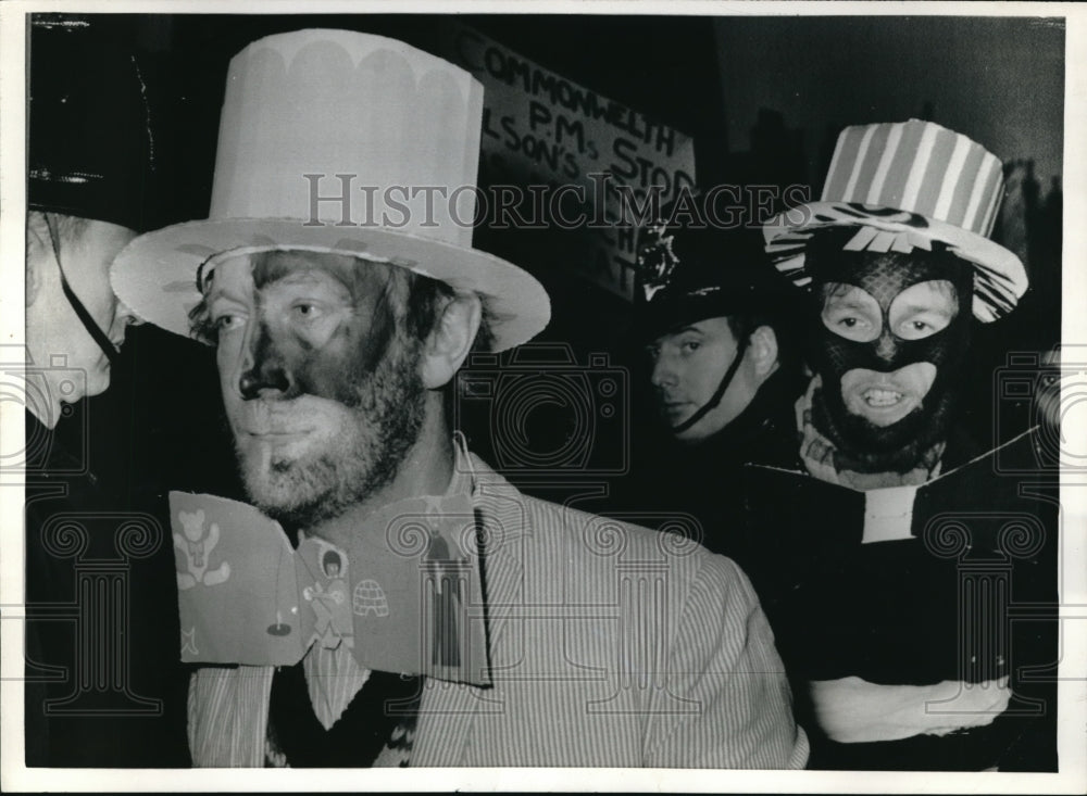 1969 Press Photo Demonstrators faces half black & half white in Marlborough