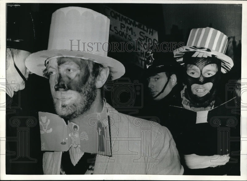 Load image into Gallery viewer, 1969 Press Photo Demonstrators faces half black &amp; half white in Marlborough
