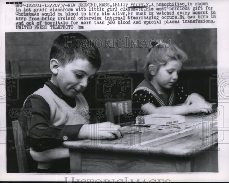 Load image into Gallery viewer, 1957 Press Photo Billy Perry, 7, A precious child being watched over asking as a
