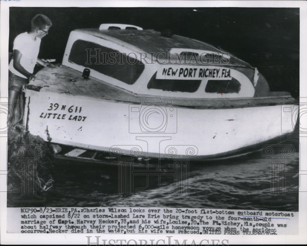 1955 Press Photo Erie Pa Charles Wilson on his sinking boat from a storm