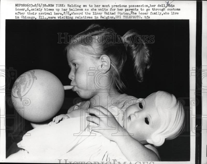 Load image into Gallery viewer, 1958 Press Photo NYC Rita Loser age 6 with her doll returns from Europe
