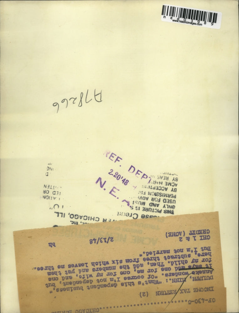 1948 Press Photo Annake Wonders looking at his tax papers