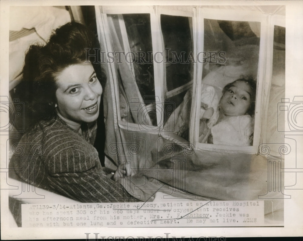1947 Media Photo Patient Jackie Anthony receives food from mother Mrs JF Anthon