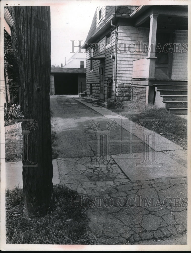 1969 Media Photo Mrs James Jones cracked driveway & pole in Cleveland