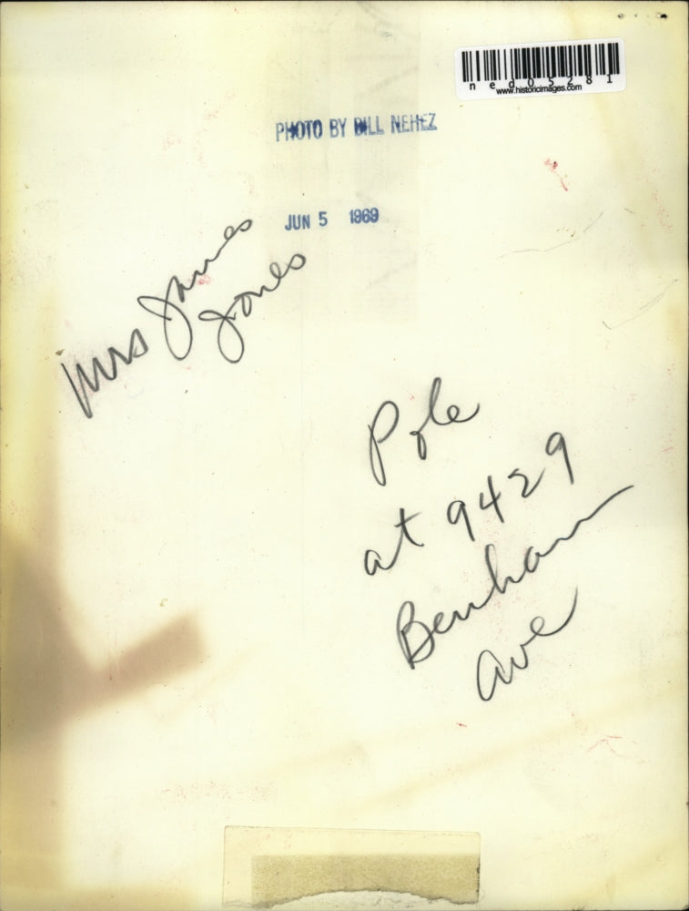 1969 Media Photo Mrs James Jones cracked driveway & pole in Cleveland