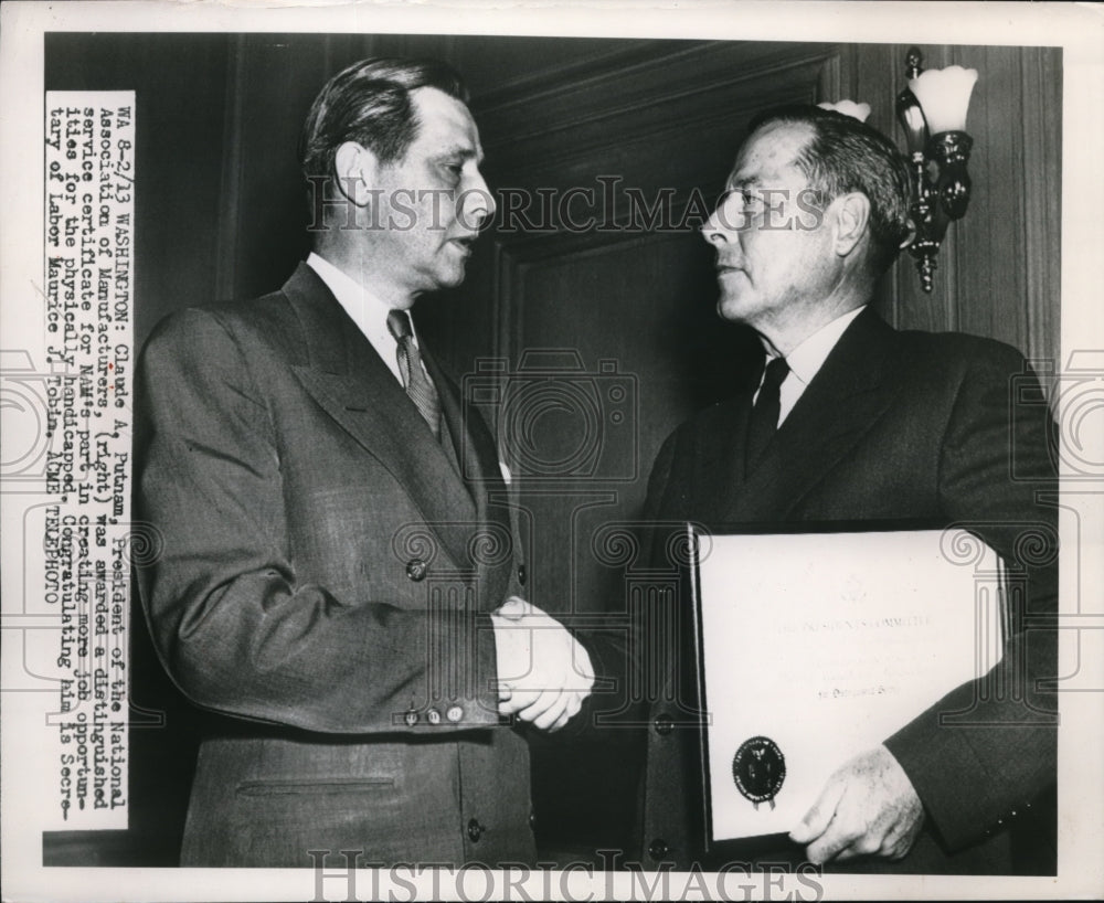 1950 Media Photo Claude A. Putnam awarded a distinguished service certificate