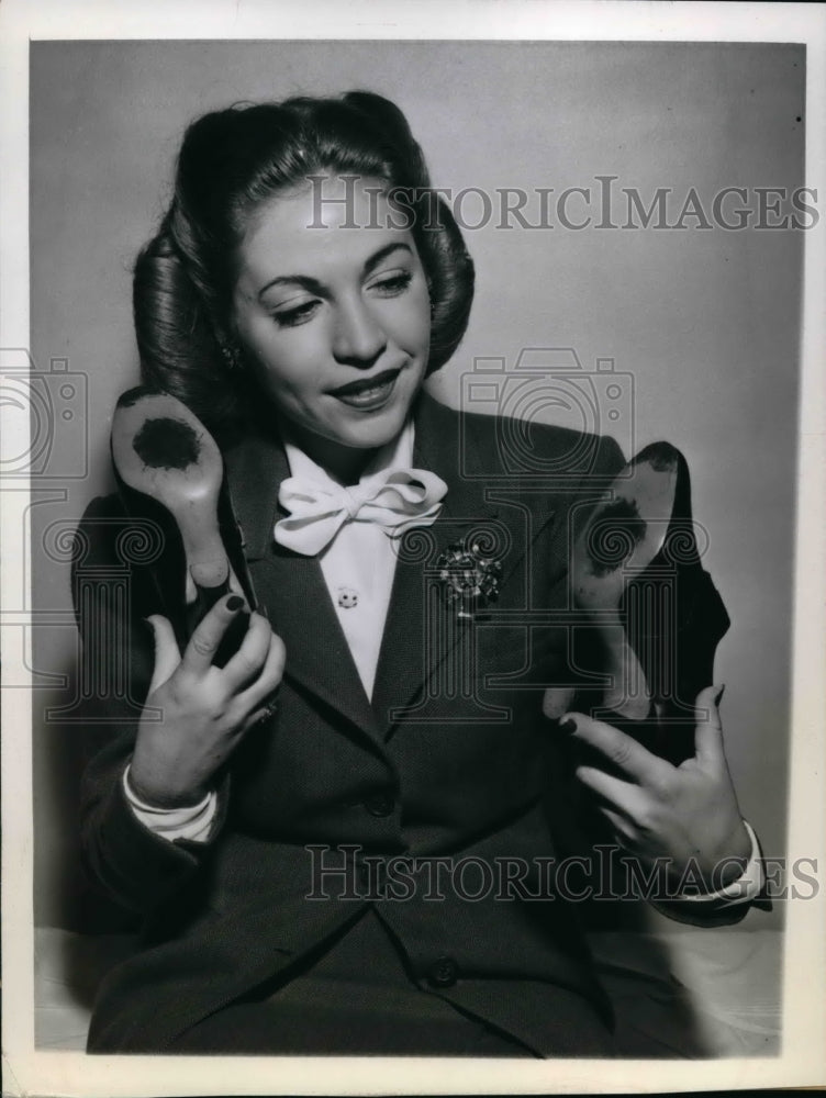Load image into Gallery viewer, 1944 Press Photo Sheila Altman on shoes patched with leatherlyk material
