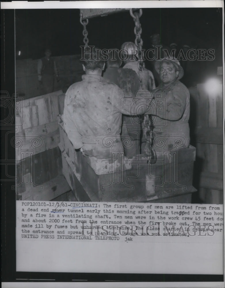 Load image into Gallery viewer, 1961 Press Photo Cinncinati Ohio rescue of workers from sewer tunnel collapse
