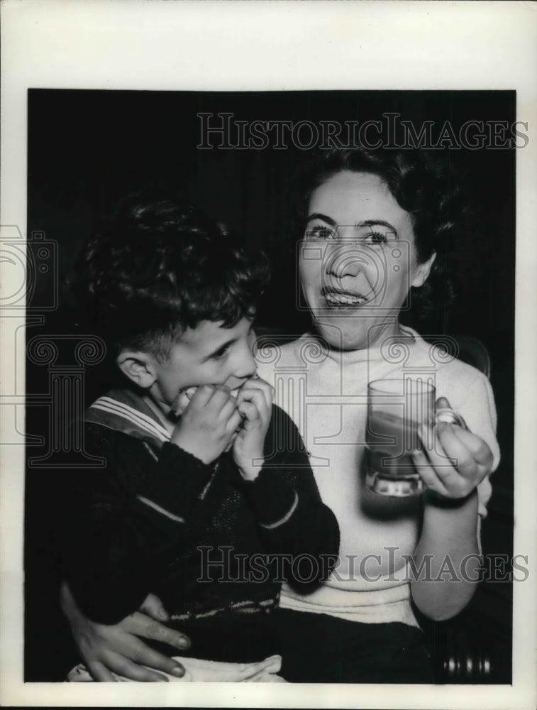 Load image into Gallery viewer, 1938 Press Photo Cleveland Ohio Mother has cup of coffee and son
