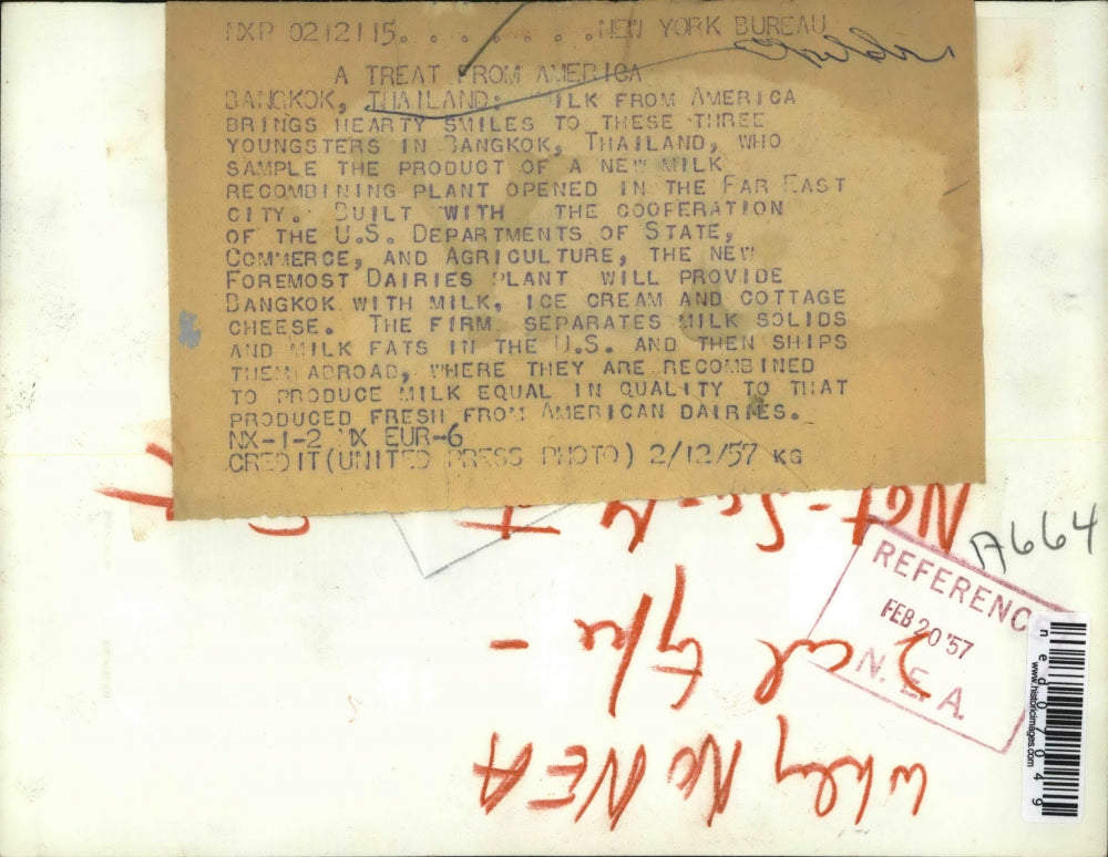 1957 Press Photo Bangkok Thailand 3 youngsters sample milk product from new