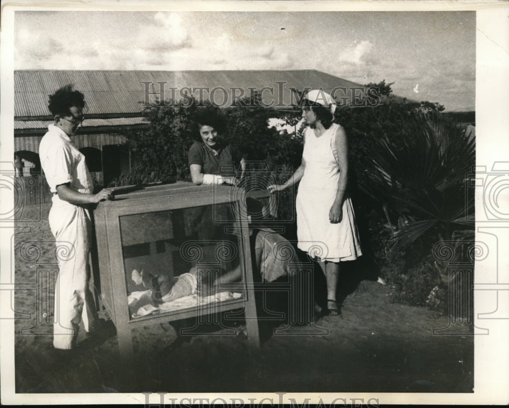 1934 Media Photo Mother and Father Admiring Child with Caretaker