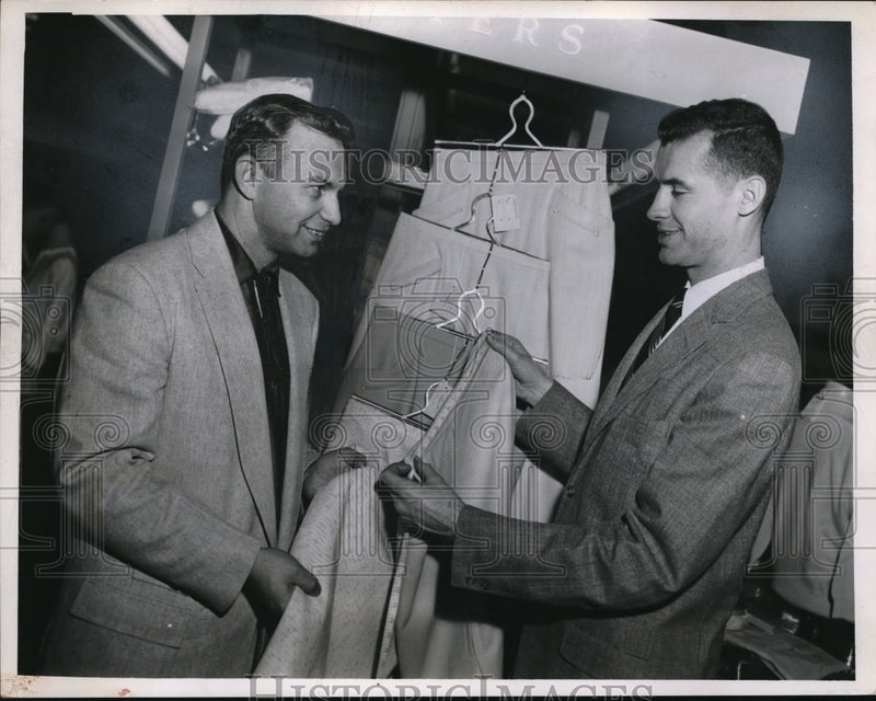 Load image into Gallery viewer, 1956 Press Photo Chester Dudzinski shops for clothes and assisted by Groff
