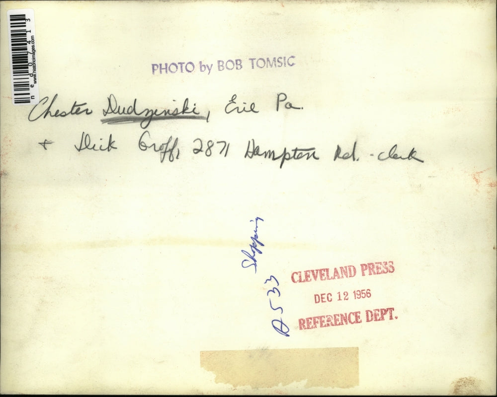 1956 Press Photo Chester Dudzinski shops for clothes and assisted by Groff