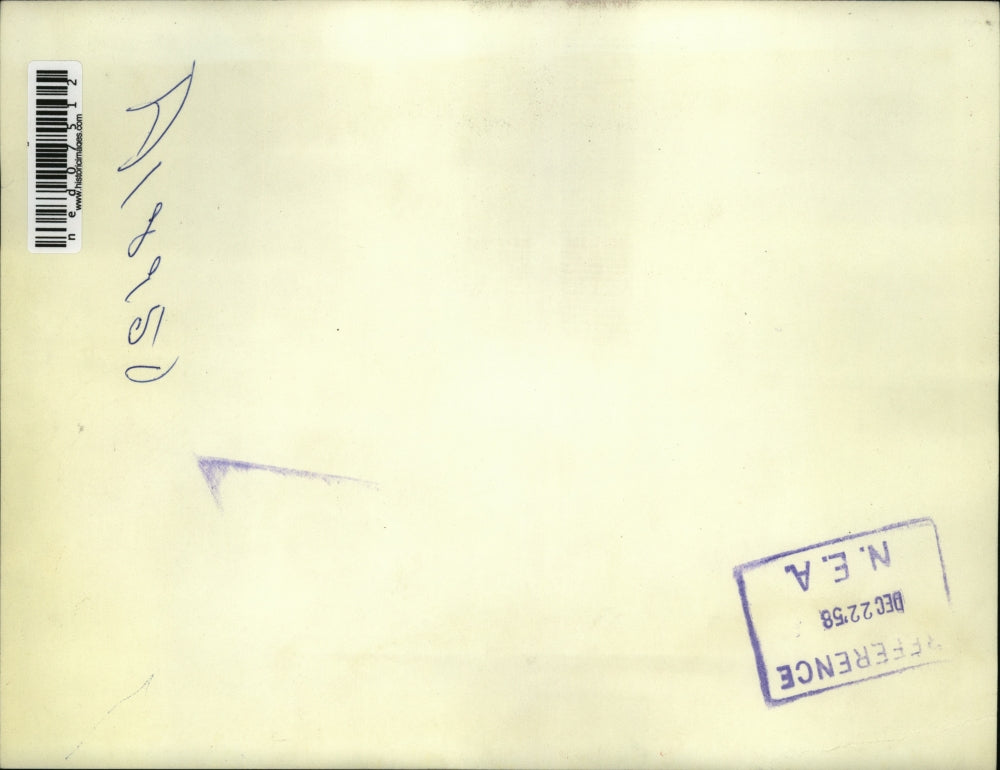 1958 Press Photo A child tears into a present that says "Do not open until X-mas