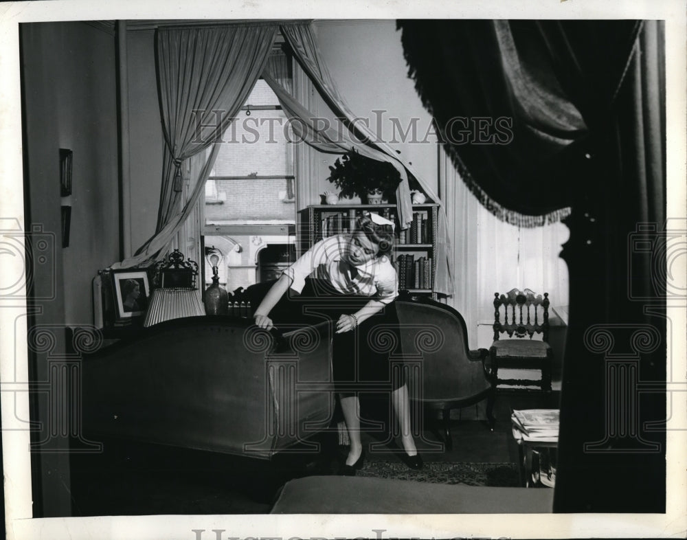 1941 Press Photo Miss Smith re-arranging the furniture for a home cure