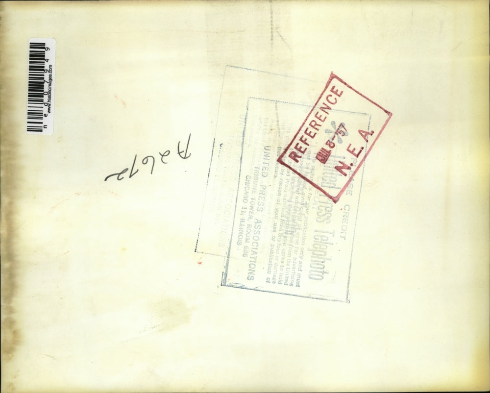 1957 Press Photo Mechanical hand breaks ribbon at the opening of new laboratory