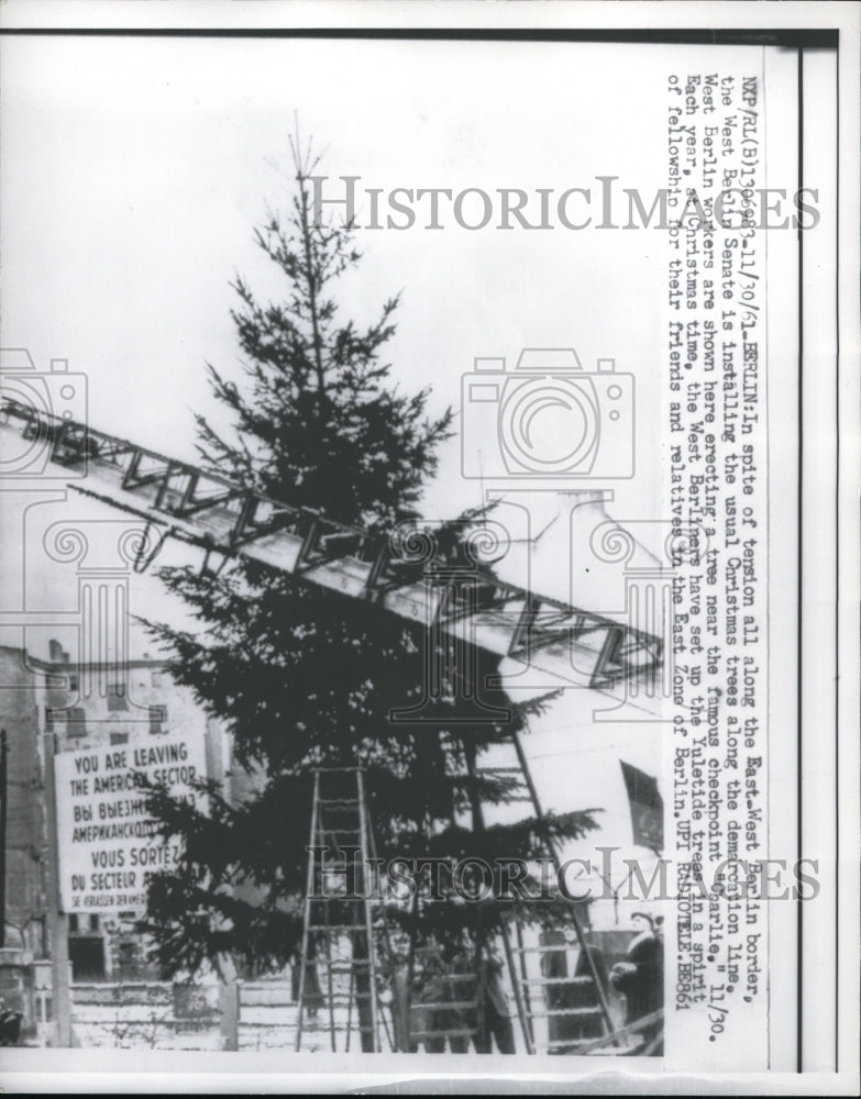 Load image into Gallery viewer, 1961 Press Photo The installation of giant Christmas tree in West Berlin
