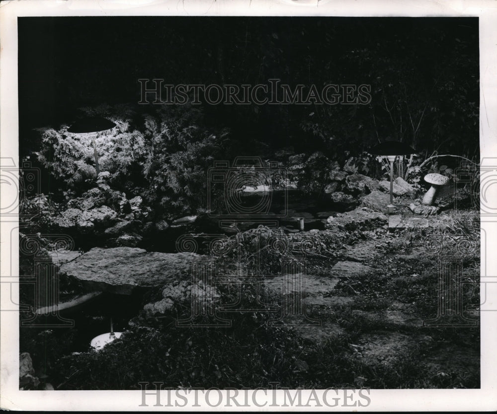 1959 Press Photo A flower garden with a lily pond in it