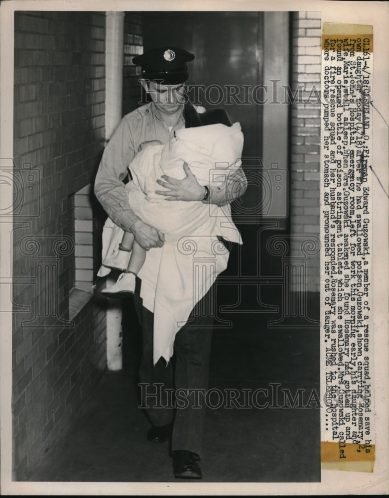 1951 Press Photo Cleveland Ohio fireman Ed Guzowski & daughter he rescued
