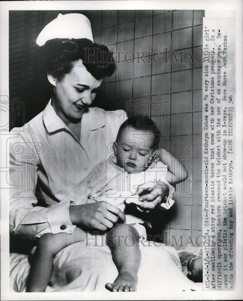 1951 Press Photo Kathryn Eskew and Nurse Jean Parham with Toy Baby Swallowed