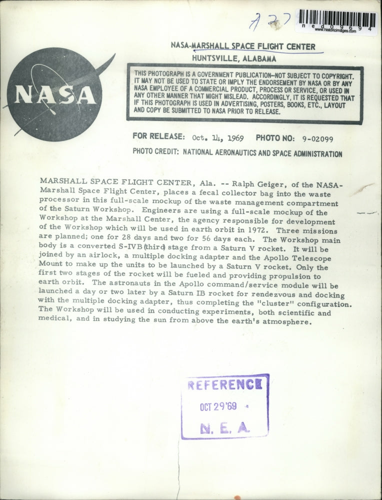 Load image into Gallery viewer, 1969 Press Photo Ralph Geiger of the NASA placed a fecal collector bag
