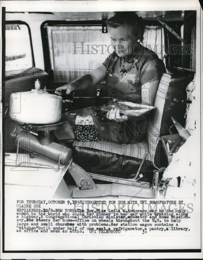 1958 Media Photo Rev. Leila Anderson cooks her dinner in her car.