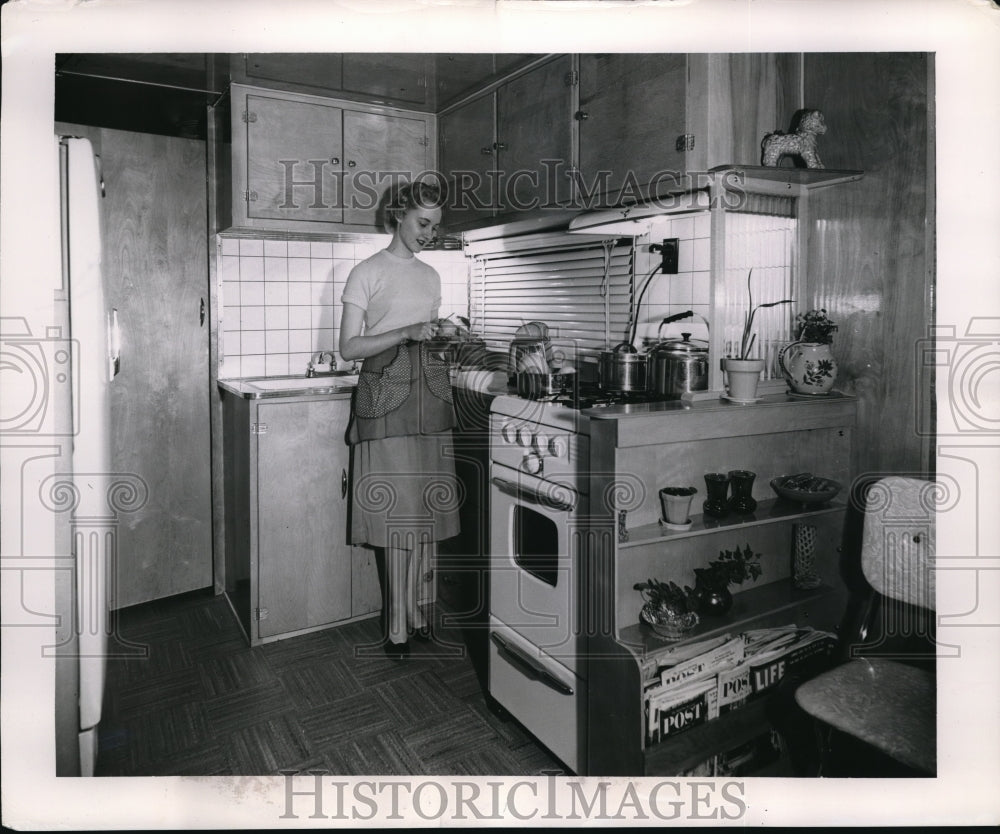 1955 Media Photo Woman Preparing Meal in Mobile Home Kitchen