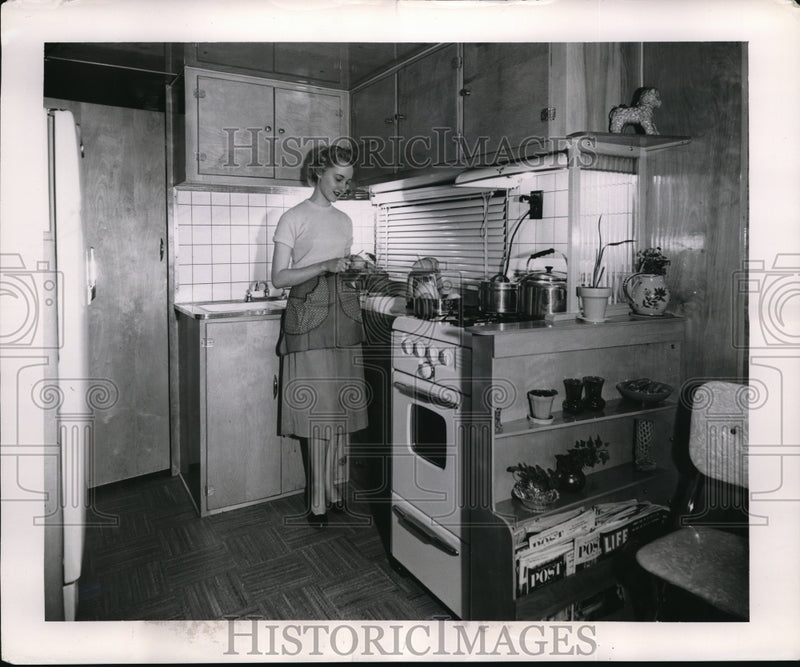Load image into Gallery viewer, 1955 Media Photo Woman Preparing Meal in Mobile Home Kitchen
