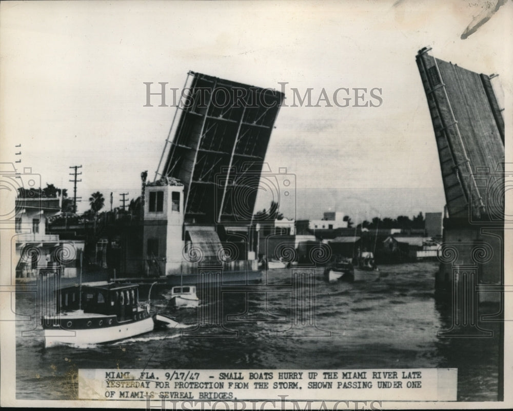 1947 Media Photo The small boats at the Miami river hurry up for protection