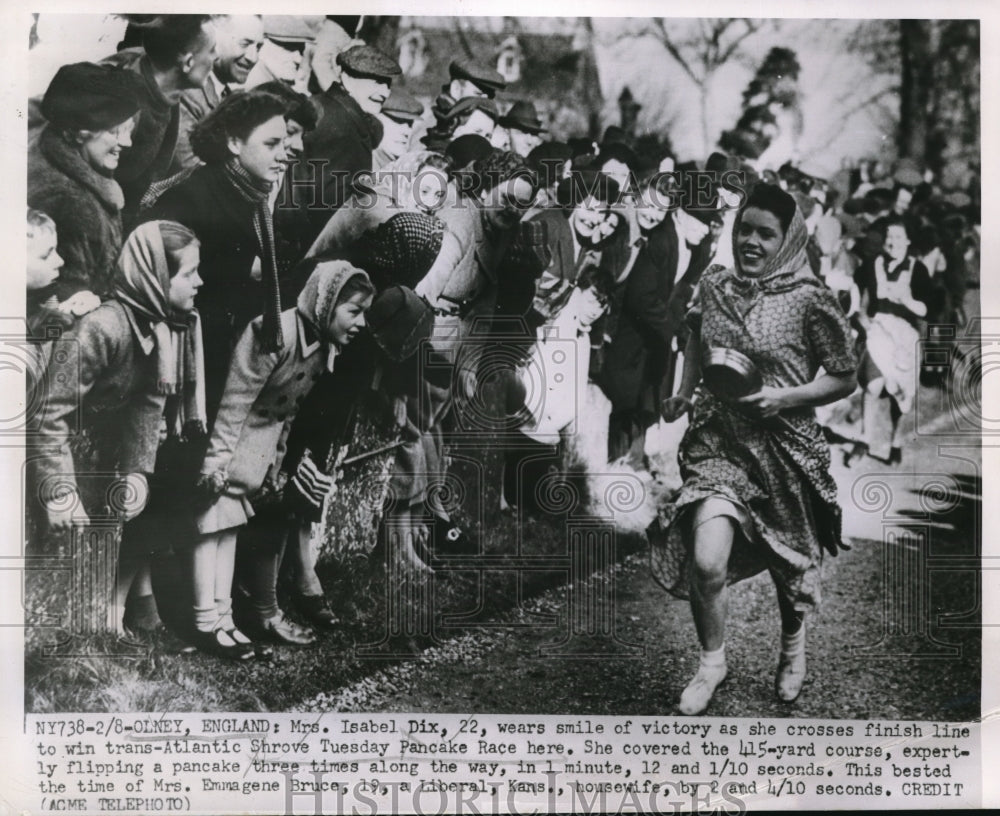 1951 Media Photo Mrs. Isabel Dix crosses the finish line to win