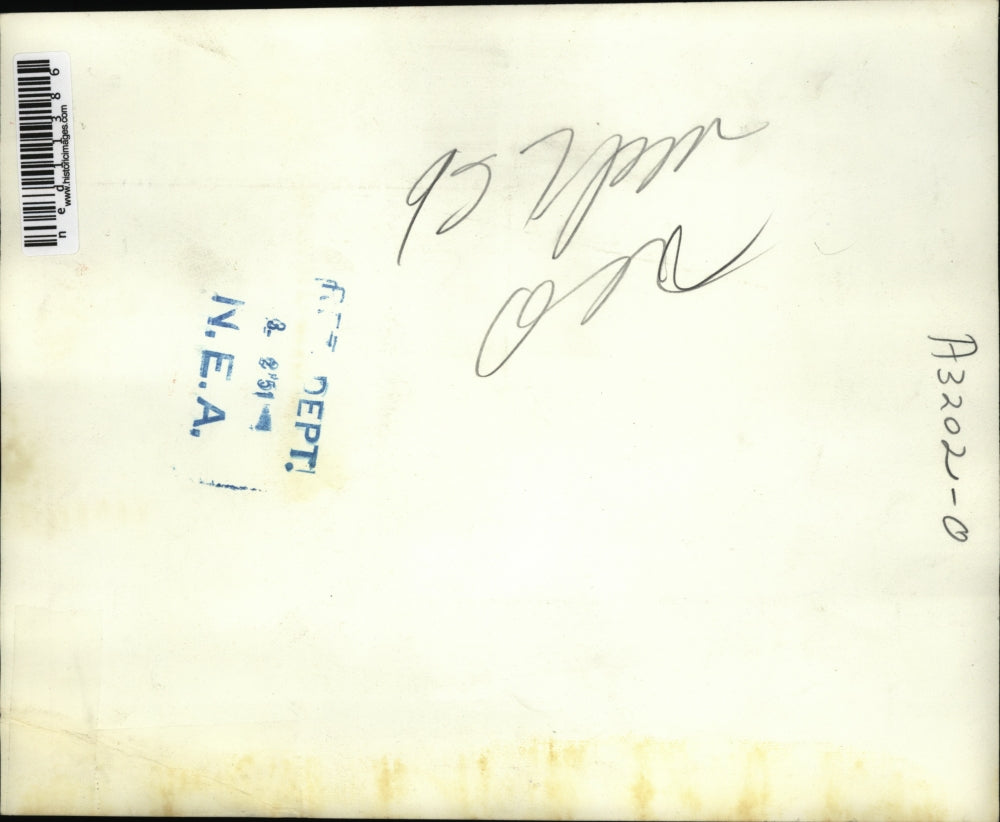 1951 Media Photo Mrs. Isabel Dix crosses the finish line to win