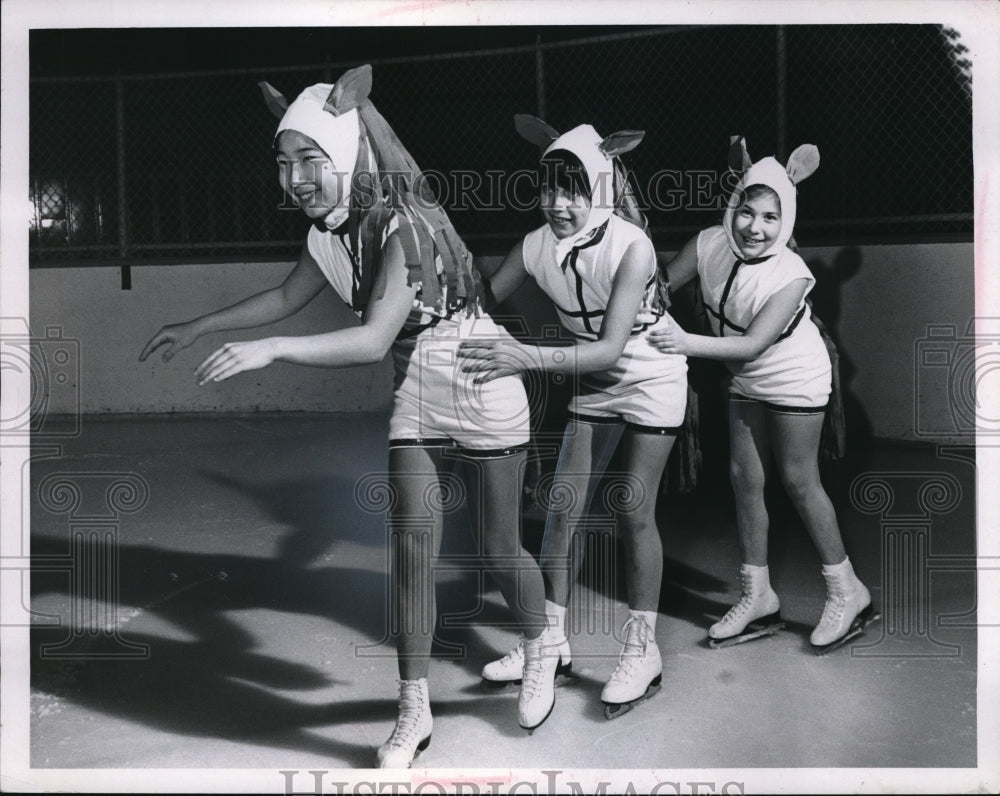 Media Photo Esther Akita, Mary Ann Evano and Laura Suster. Ice skating.