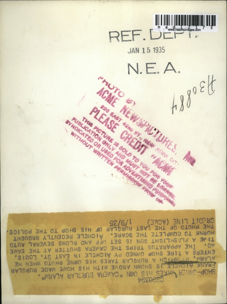 1935 Media Photo Frank Aichele with his home made alarm with camera