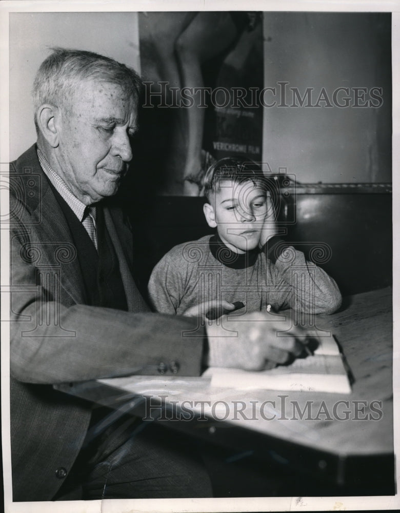 1953 Media Photo Dr Fred Hagy Signing Last Man's Club Ledger While Child Watches