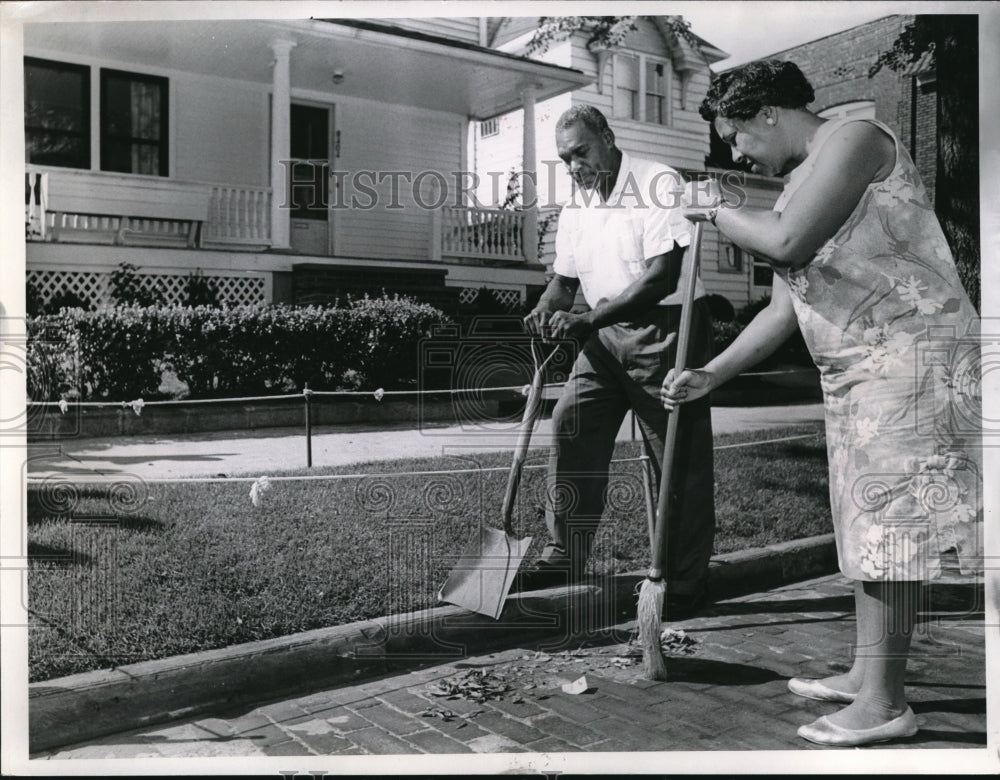 1966 Media Photo Otha, Mary Langdon Sweep Leaves in Front of Cleveland Home