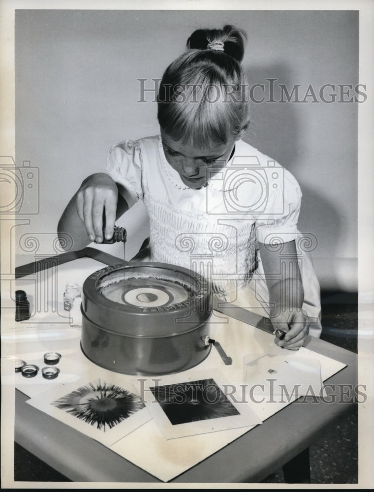 1962 Media Photo Patrice Downey tries the new kusan toy called electro swirl art