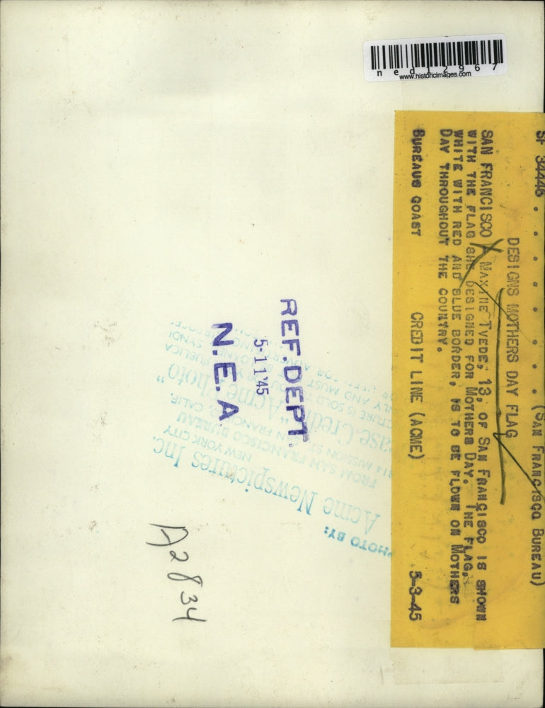 1945 Media Photo Maxine Tvede with the flag she designed for Mother's Day