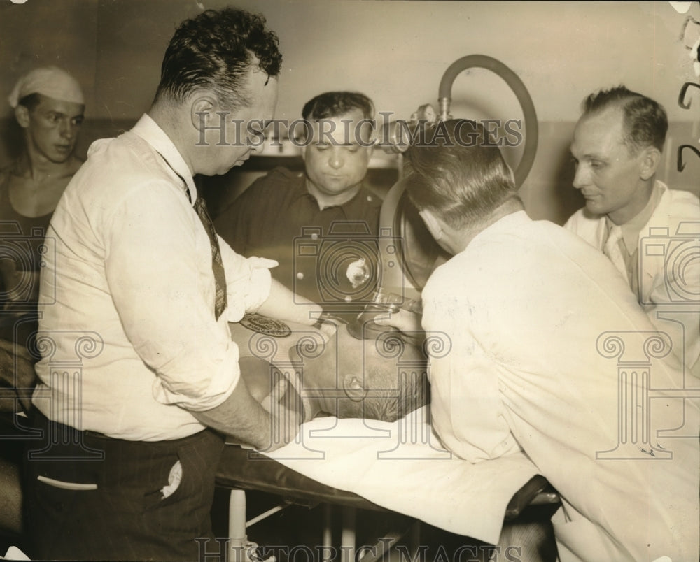 1938 Media Photo City Doctore and Police working over Allen Stepnnolr who was